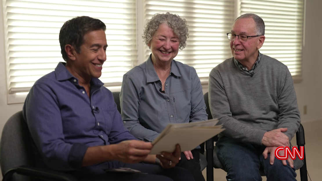 CNN Chief Medical Correspondent Dr. Sanjay Gupta, left, talks to Mike Carver, right and his wife, Pat.